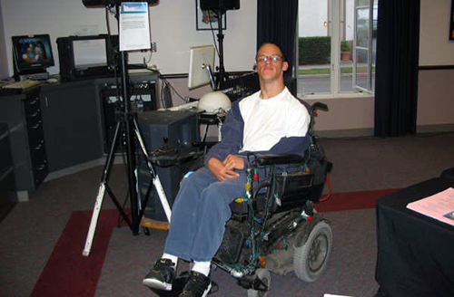 Photo of DJ Chris Benedict with his audio equipment.