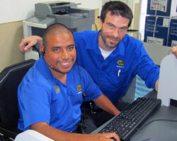 Photo of Jonathon Rosales at work at Best Buy with his colleague Gil