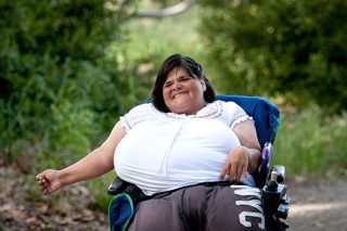 Portrait in the park of woman in wheel chair.