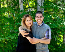 Hispanic mom hugs her teen son with Autism in the park