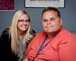 Individual served sits with caregiver in his home