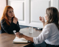 Young woman talks with her service coordinator, mental health discussion