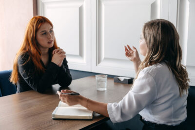 Young woman talks with her service coordinator, mental health discussion