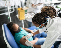 Young woman with special needs getting vaccinated in a medical clinic