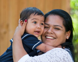 Young Hispanic mother with her infant son