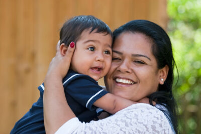 Young Hispanic mother with her infant son