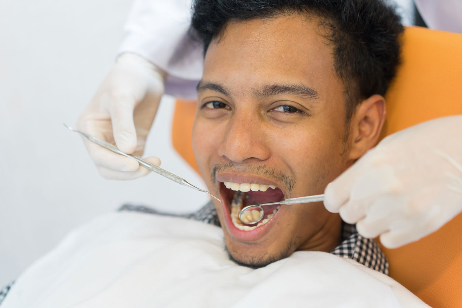 Dental patient opens his mouth for a cleaning