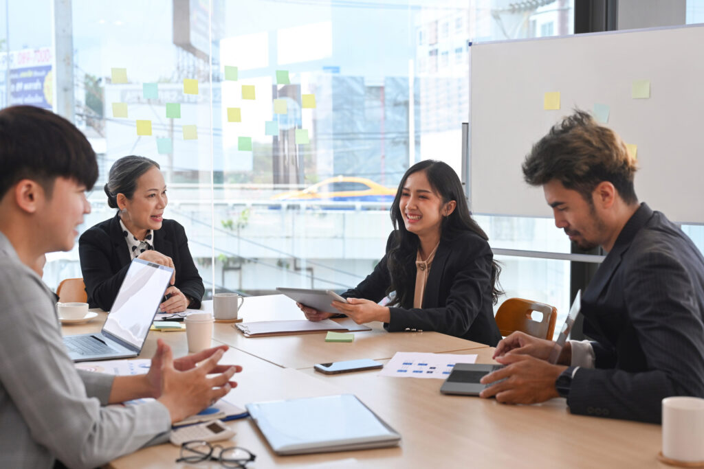 group of people at a conference table having a discussion