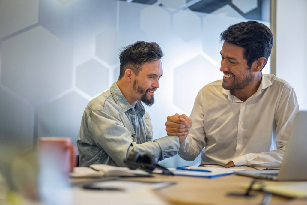 A person served shakes the hand of a service provider