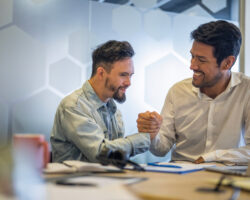 A person served shakes the hand of a service provider